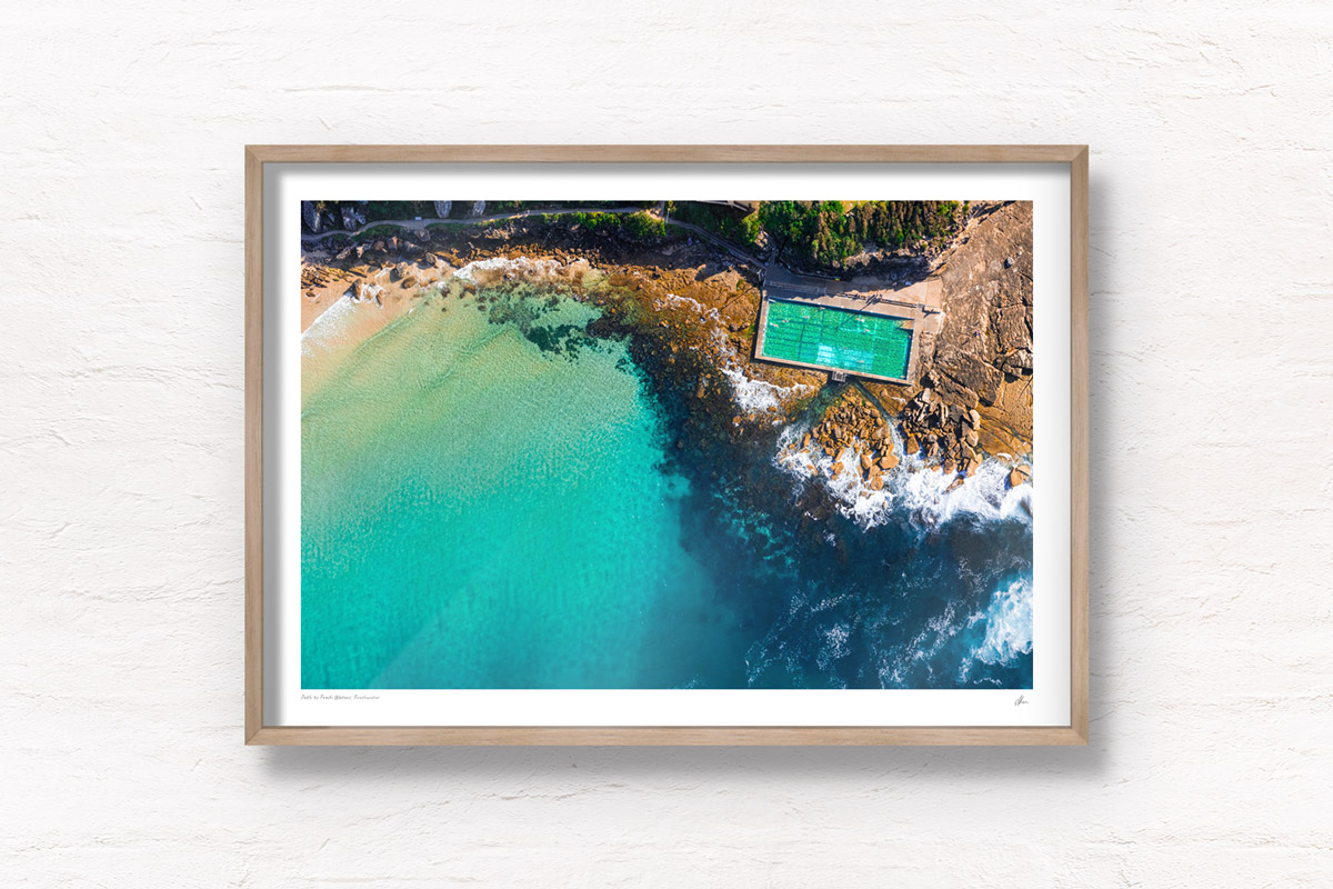 Aerial oceanscape above turquoise crystal clear waters of Freshwater Rockpool. Summer, swimming, oceanpool