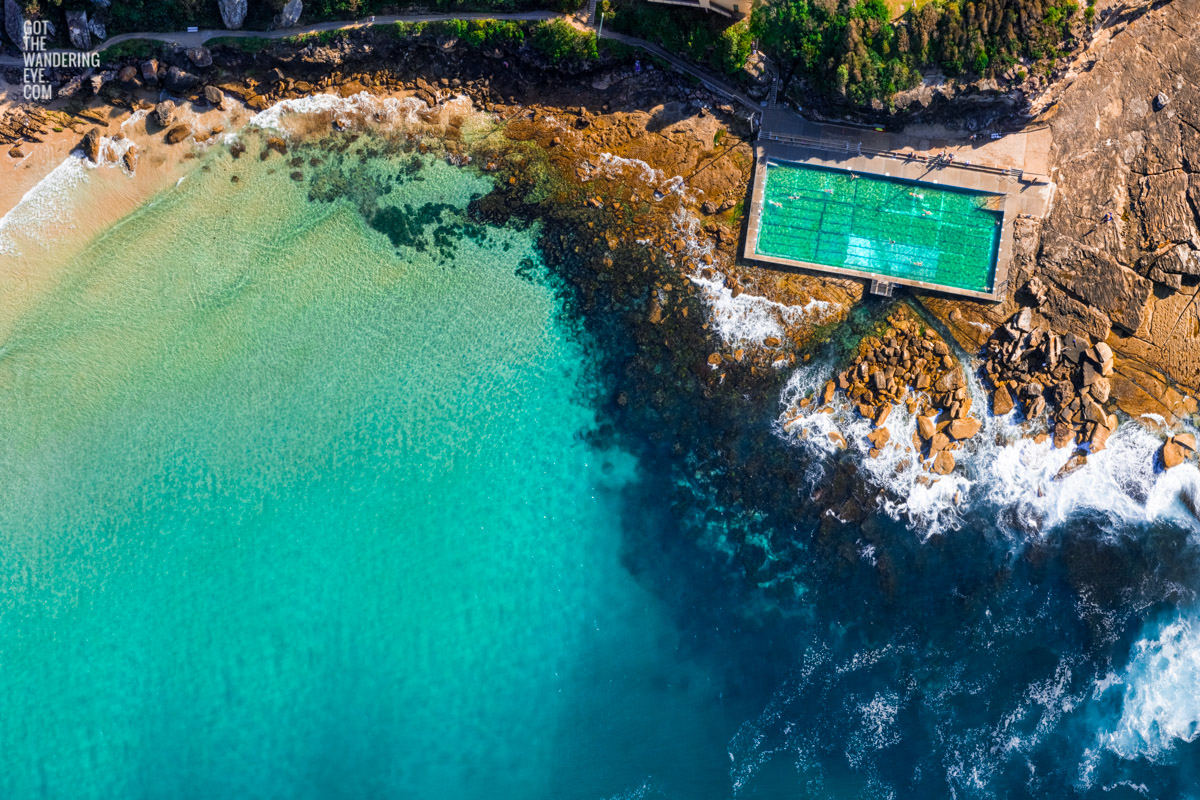 Aerial oceanscape above turquoise crystal clear waters of Freshwater Ocean Pool. Summer, swimming, oceanpool