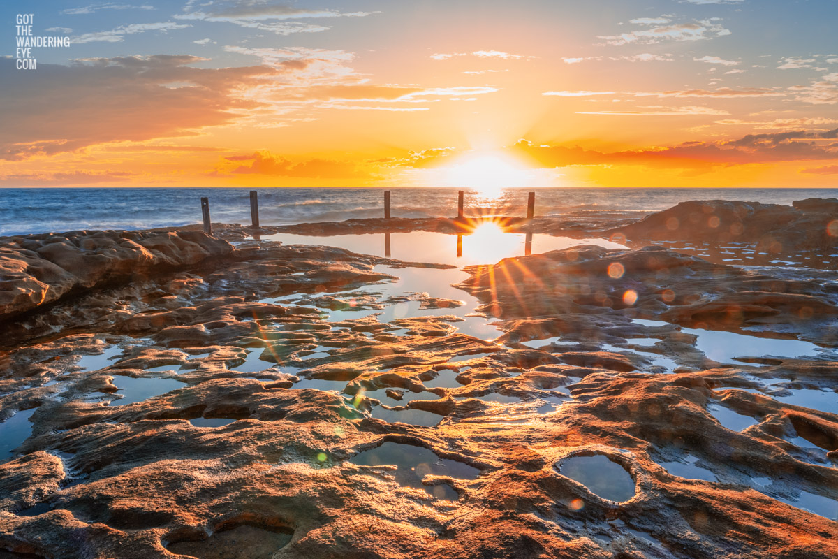 Long exposure photo of Wylies Baths ocean rockpool during sunrise at Coogee