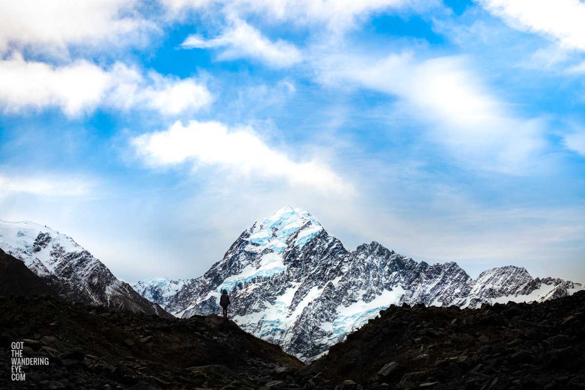 Woman gazing at the peak of Aoraki Mount Cook New Zealand by Allan Chan