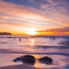 Swimmers enjoying a beautiful sunrise with whispy clouds over Bronte Beach, Sydney by Allan Chan