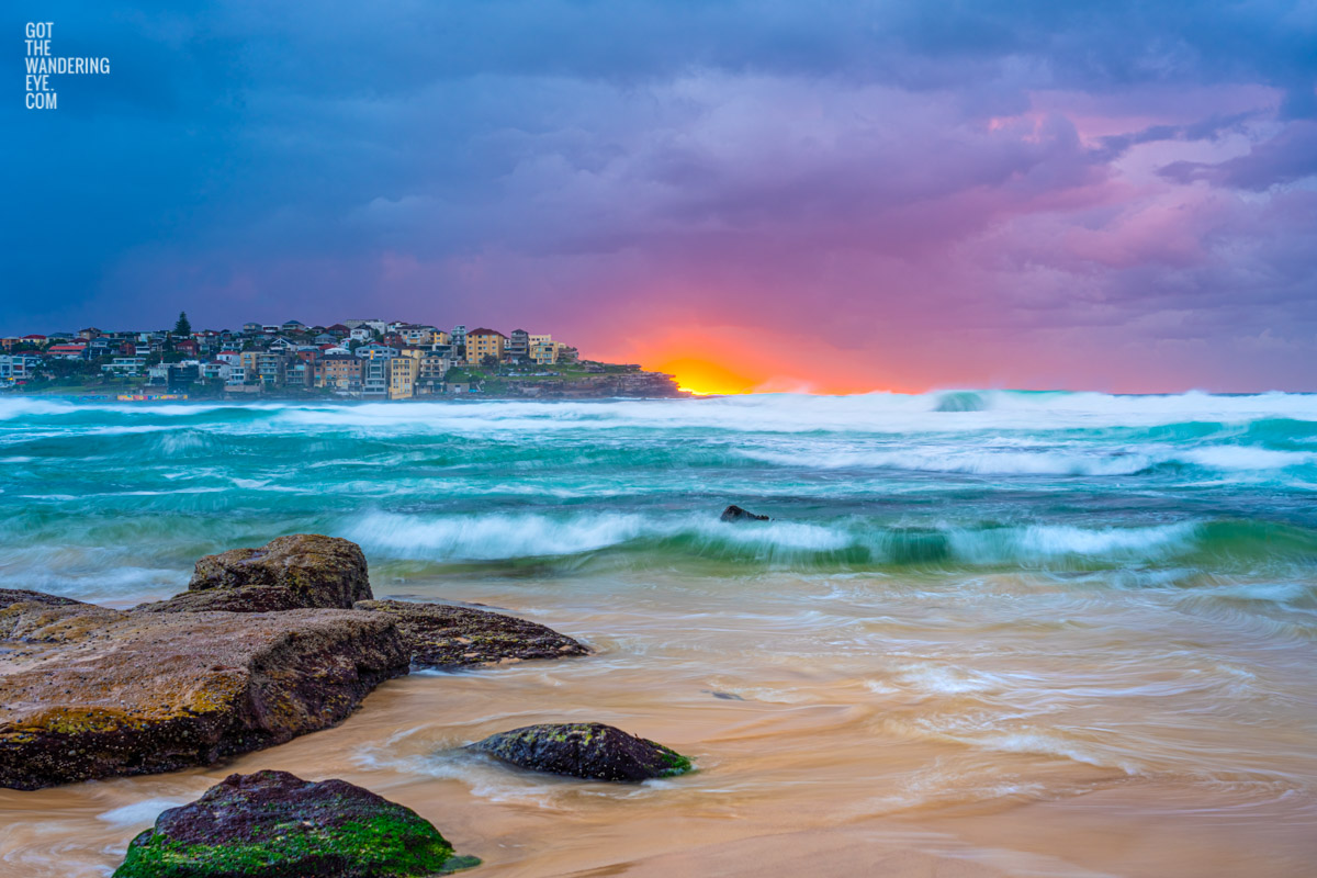 Stormy cloudy sunrise over Ben Buckler at Bondi Beach