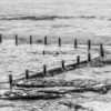 2 woman enjoying a swim at Maroubra. Waves crashing over mahon pool ocean rockpool.