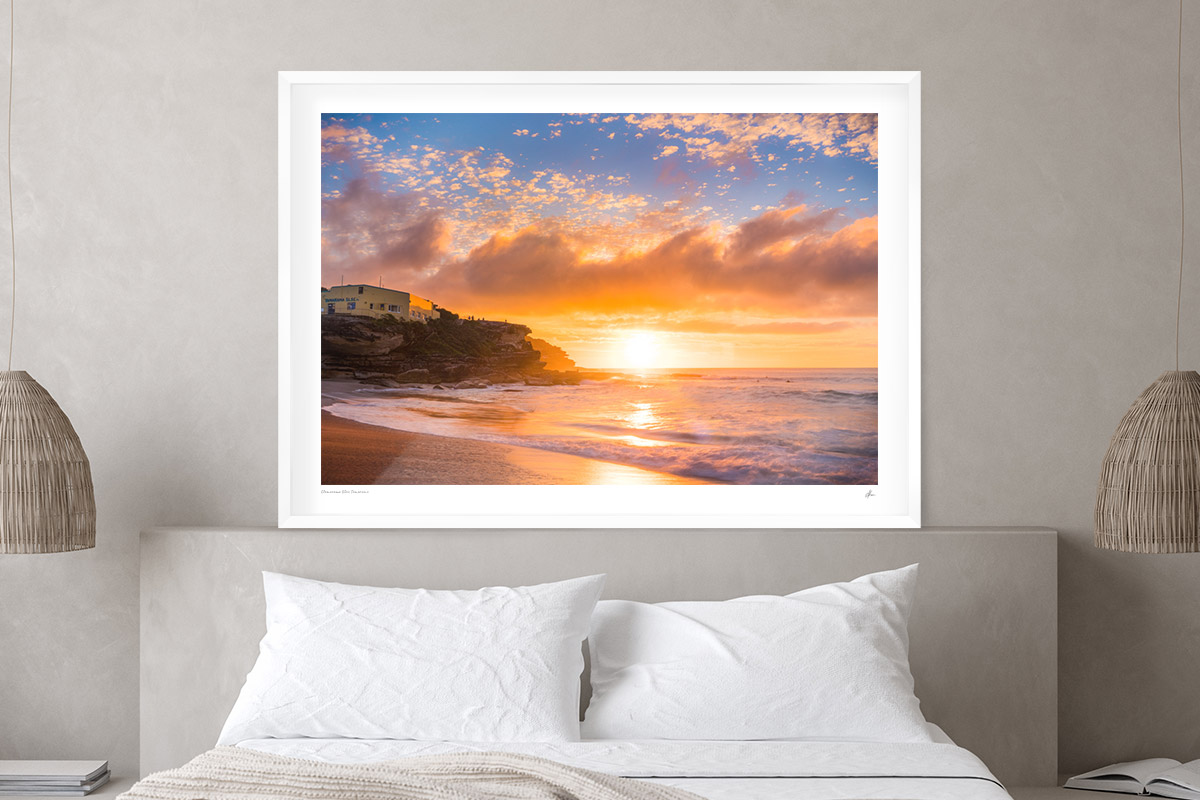 Print Framing Options. Classic white custom framed print. Sunrise through puffy clouds rising over Tamarama Beach. 