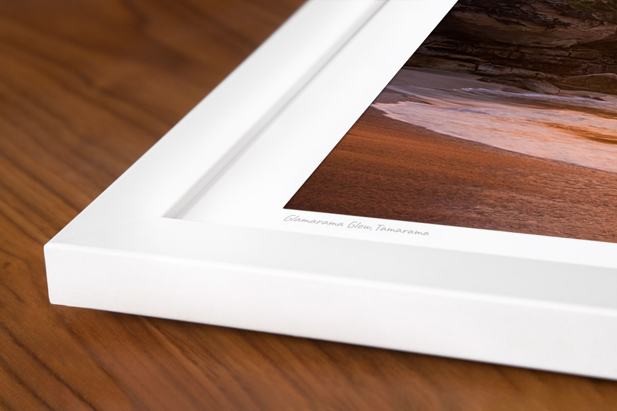 Print Framing Options. Classic white custom framed print. Sunrise through puffy clouds rising over Tamarama Beach.