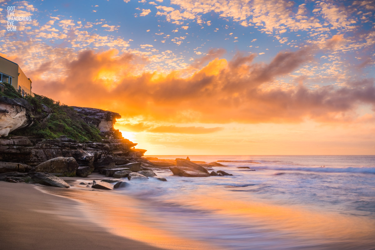 Hot and steamy sunrise above the clifftops of Tamarama point at Tamarama Beach