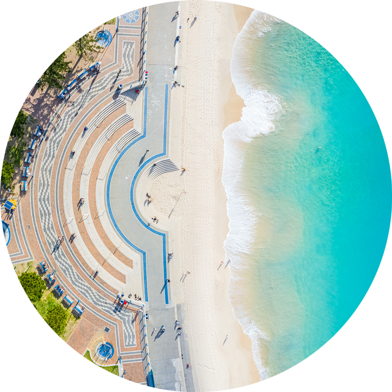 Ocean Aerial Coogee Beach. ChromaLuxe round metal print of the ocean. Aerial oceanscape above Coogee Beach promenade. Wall art delivered and ready to hang.