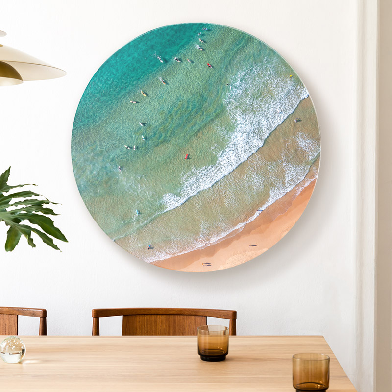 ChromaLuxe round metal wall art ocean prints. Aerial oceanscape above surfers in the lineup at Freshwater Beach
