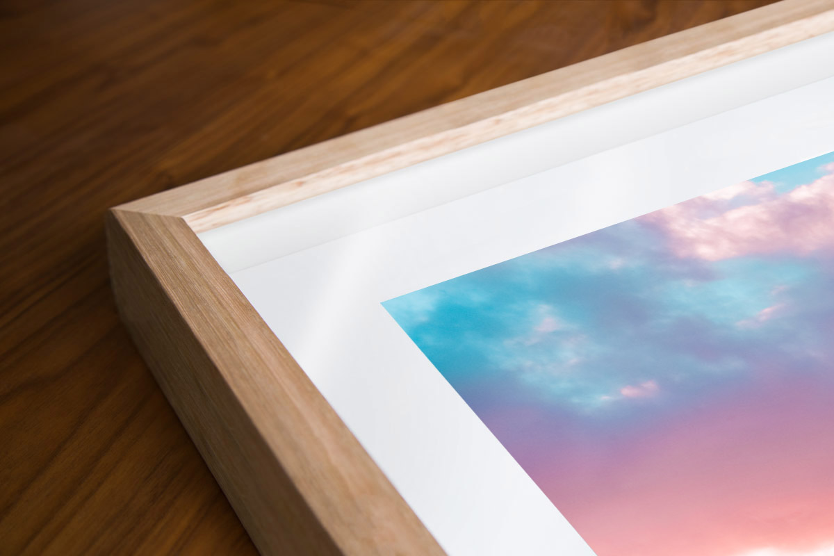 Print Framing Options. Oak wood shadow box framed print. Puffy cotton candy coloured clouds during sunrise at Bronte Baths Rockpool.