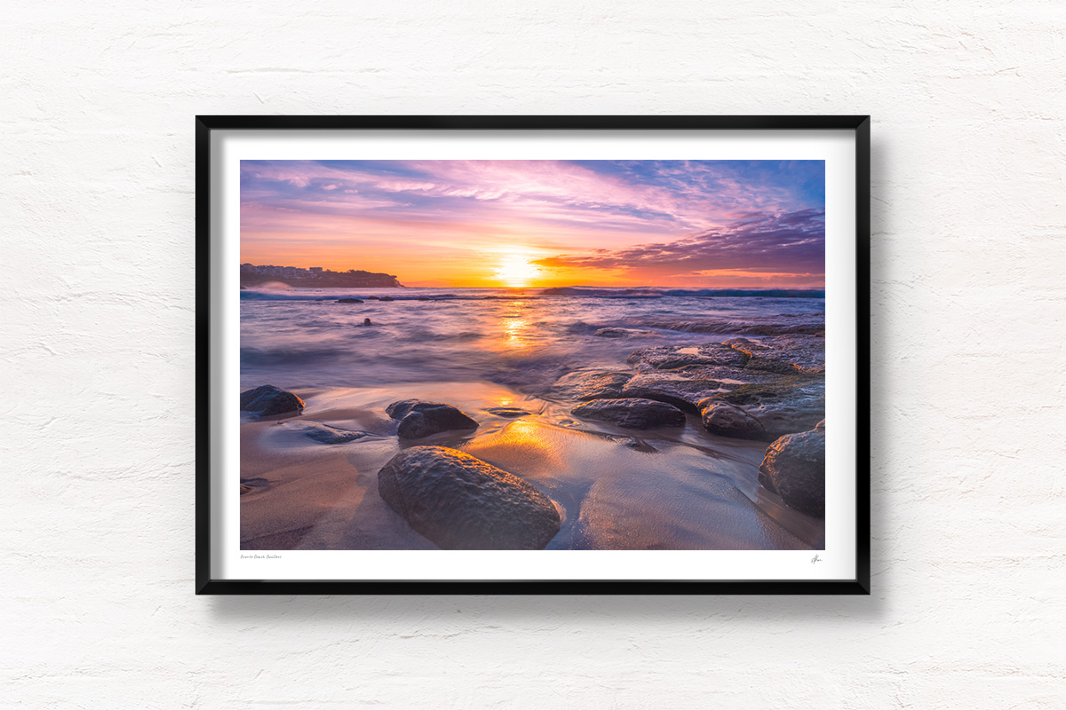 Framed wall print of a swimmer enjoying a beautiful purple sky sunrise over the Bogey Hole at Bronte Beach