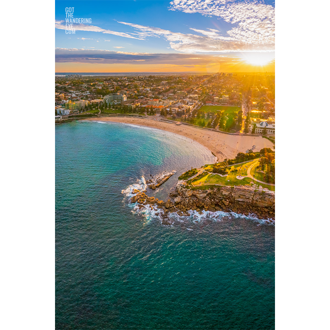 Aerial seascape above Dolphins Point Coogee overlooking a golden sunset, Coogee Beach