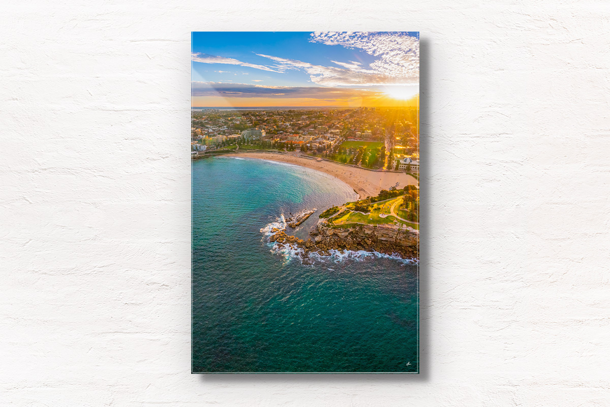 Aerial seascape above Dolphins Point Coogee overlooking a golden sunset, Coogee Beach