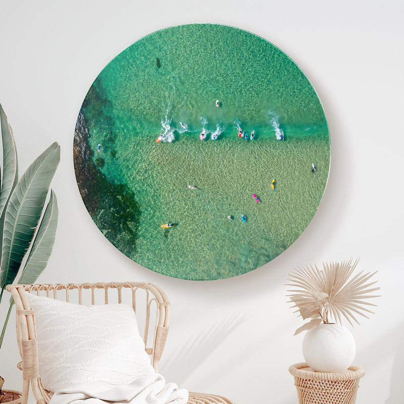 ChromaLuxe metal print of aerial oceanscape above surfers with colourful surfboards in North Bondi. Modern coastal loungeroom wall art.