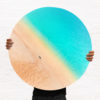 ChromaLuxe metal circle print of a woman standing on a deserted beach with turquoise coloured water