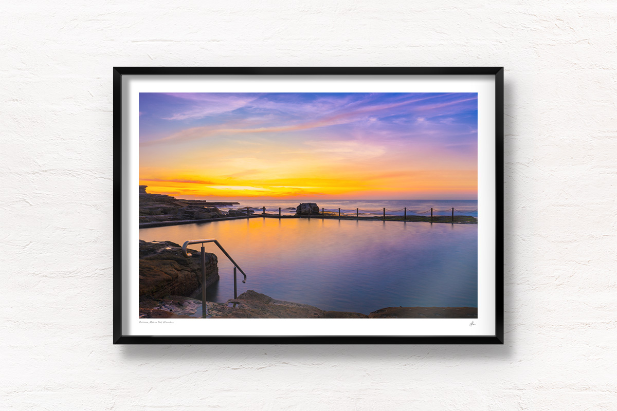Buy black framed wall art prints. Passionfruit coloured sunrise over a empty long exposure of Mahon Pool at Maroubra