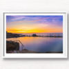 Passionfruit coloured sunrise over a empty long exposure of Mahon Pool at Maroubra