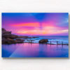 Framed wall art print of a pink and purple aurora sky, over a empty still Mahon Pool, Maroubra