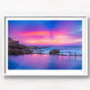Framed wall art print of a pink and purple aurora sky, over a empty still Mahon Pool, Maroubra
