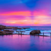 Pink and purple aurora sky, over a empty still Mahon Pool, Maroubra