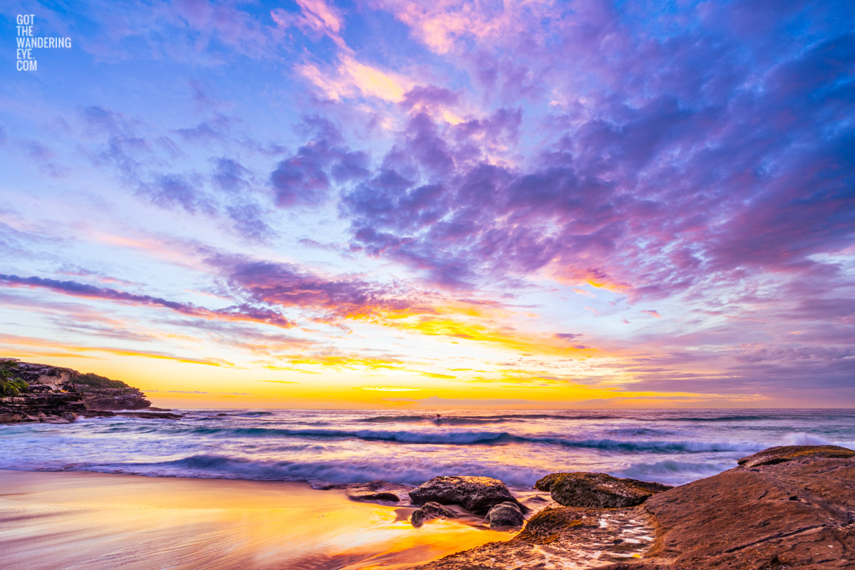 Tamaramaloha sunrise. Surfer at Tamarama Beach on a wave during a spectacular sunrise, reminiscent of a Hawaiian paradise.