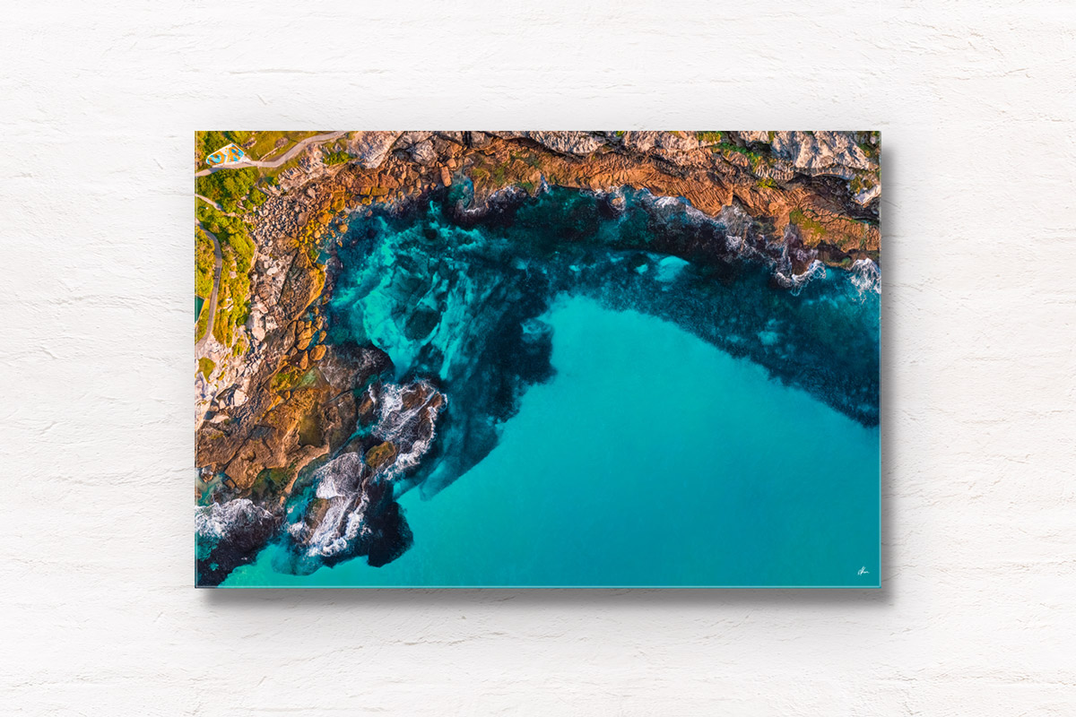 Aerial above Mackenzies Bay Tamarama. Calm, clear turquoise waters in the inlet along the Bondi to Coogee coastal walk. By Allan Chan.