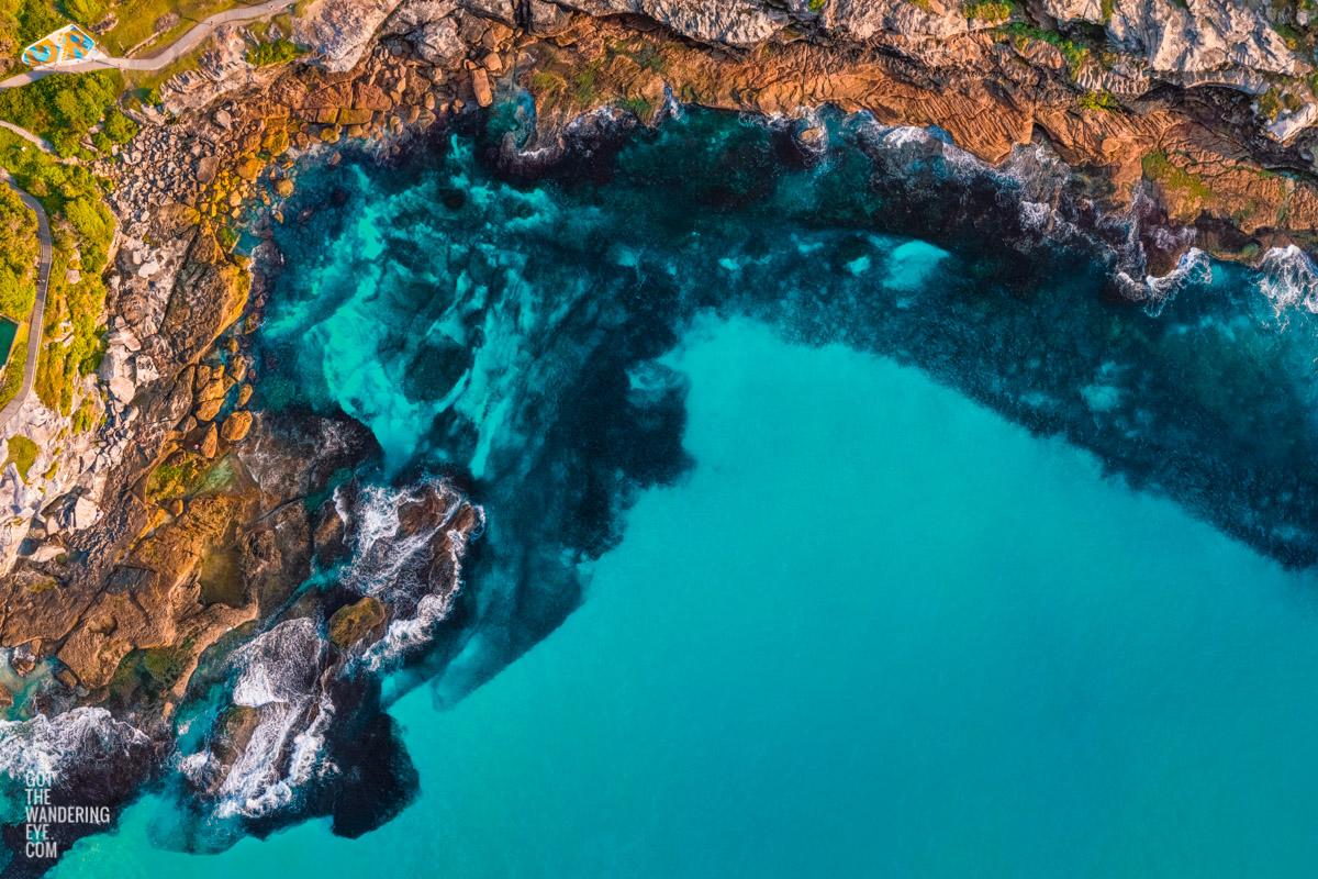 Above Mackenzies Bay Tamarama. Calm, clear turquoise waters in the inlet along the Bondi to Coogee coastal walk. By Allan Chan.