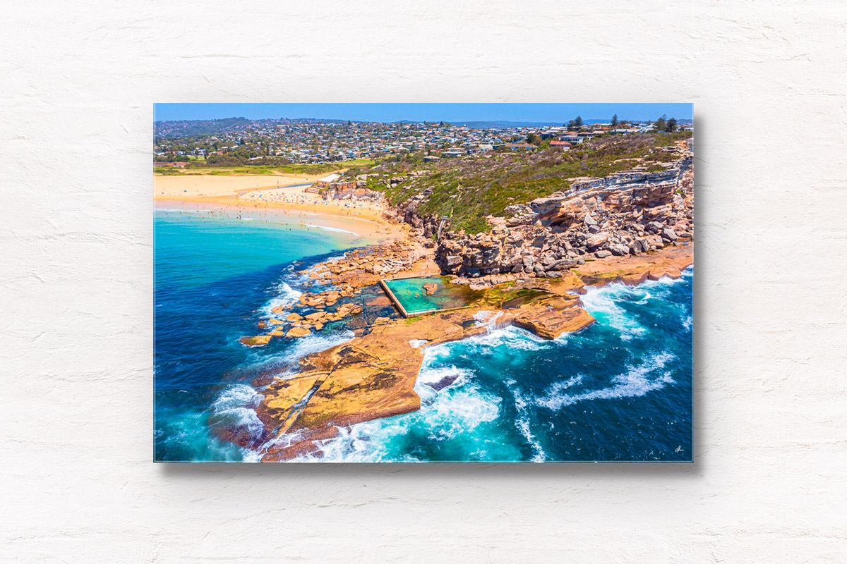 North Curl Curl aerial above the headland and one of Sydney’s best ocean rock pools. Located in the Northern Beaches.