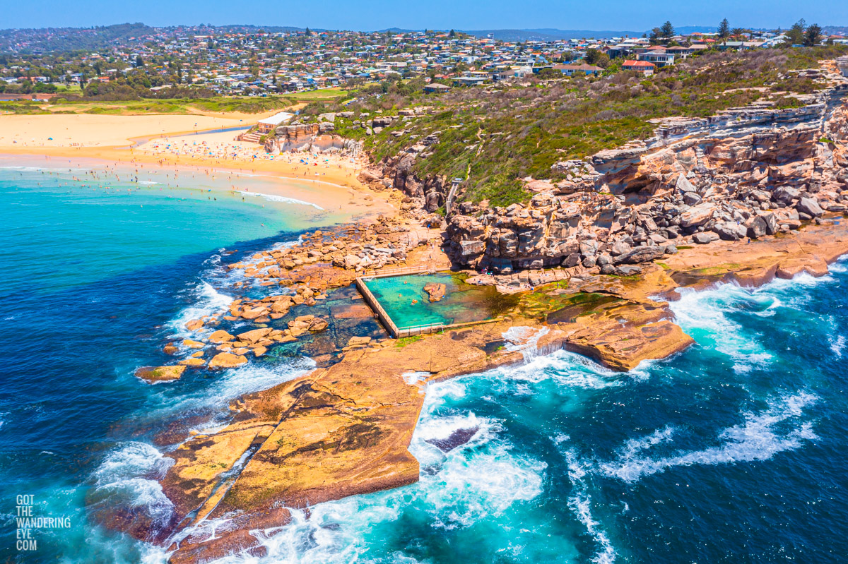 North Curl Curl aerial above the headland and one of Sydney’s best ocean rock pools. Located in the Northern Beaches.