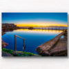 Sunrise at Sydney's Best Ocean Pool. Reflections on an empty still rock pool at Mahon Pool Maroubra by Allan Chan.