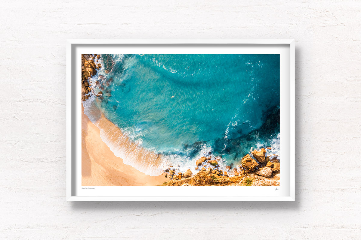 Surfing Tamarama Beach. Aerial view above surfers paddling out on the eastern suburbs best surfing beaches in Sydney. Wall Art Print.