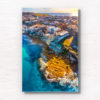Waterfront North Bondi Aerial over flat rock overlooking North Bondi boat ramp during a warm sunny morning sunrise.