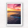 Aerial view above a Bondi Beach Sunset over the Sydney CBD skyline, glowing colour on the ocean waves.