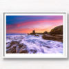 Long exposure of waves crashing over the rocks during a pink sky sunrise at Cathedral Rocks, Kiama Downs.