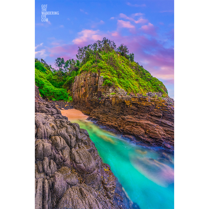 Tiny beach in between volcanic rock formation at the base of the Cathedral Rocks Cave in Kiama Downs.