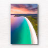 Beautiful view sunrise view above the idyllic white sand beach of Hyams Beach in Jervis Bay. Golden sunlight kissing the teal ocean.