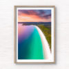 Beautiful view sunrise view above the idyllic white sand beach of Hyams Beach in Jervis Bay. Golden sunlight kissing the teal ocean.