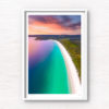 Beautiful view sunrise view above the idyllic white sand beach of Hyams Beach in Jervis Bay. Golden sunlight kissing the teal ocean.
