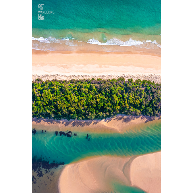 Beautiful split view above the turquoise water above Minnamurra Beach and Minnamurra River in the NSW South Coast.