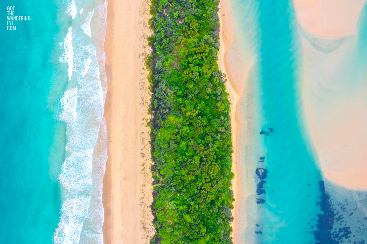 Beautiful split view above the turquoise water above Minnamurra Beach and Minnamurra River in the NSW South Coast.