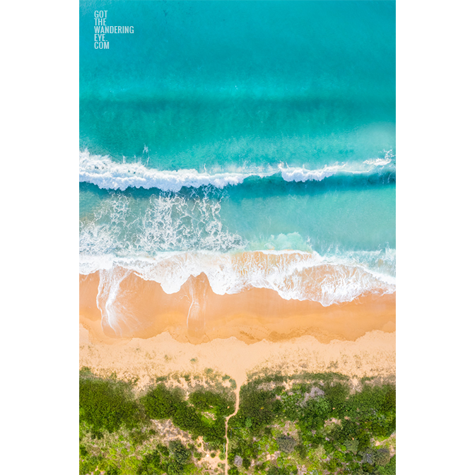 Aerial above waves crashing onto Werri Beach, Gerringong. One of NSW South Coast most beautiful Beaches.