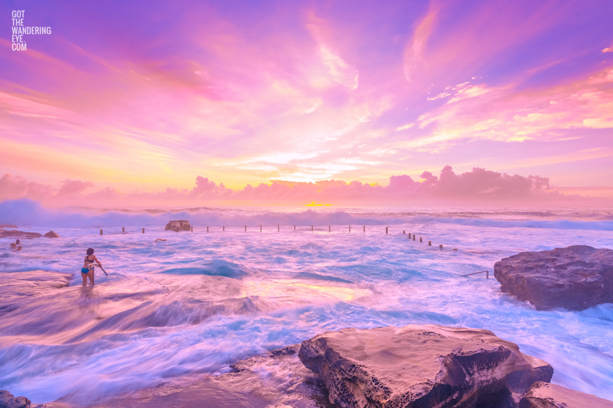 Angels in heaven Maroubra. Woman enjoying an angelic pink sky sunrise at Mahon Pool, Maroubra