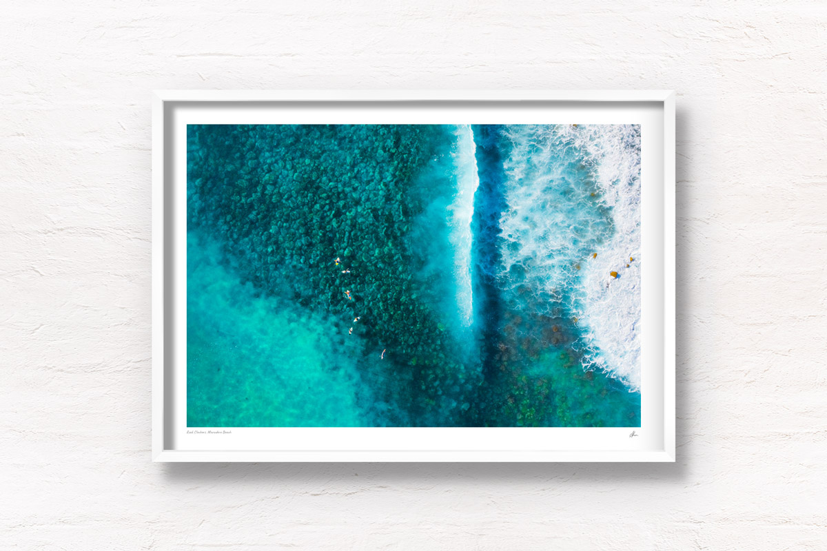 Aerial above surfers waiting for waves at Maroubra Beach. Framed art photography wall art print.