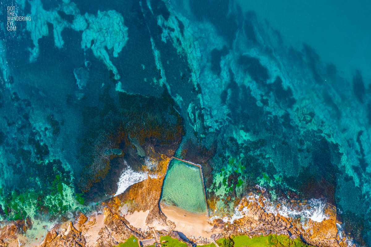 Aerial photography above a crystal clear Oak Park Rock Pool in Cronulla.