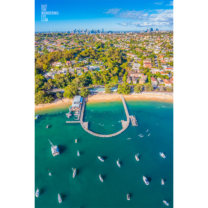 Aerial view above Balmoral Beach Wharf looking back towards the Sydney City skyline.