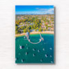 Aerial view above Balmoral Beach Wharf looking back towards the Sydney City skyline. Framed art photography wall art print.