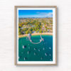 Aerial view above Balmoral Beach Wharf looking back towards the Sydney City skyline. Framed art photography wall art print.