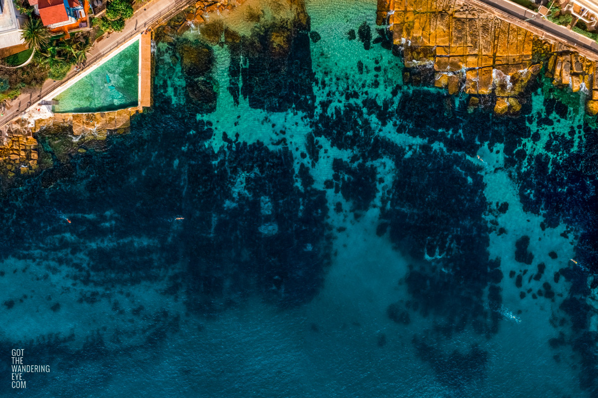 Aerial view above beautiful blue Fairy Bower rock pool and beach.