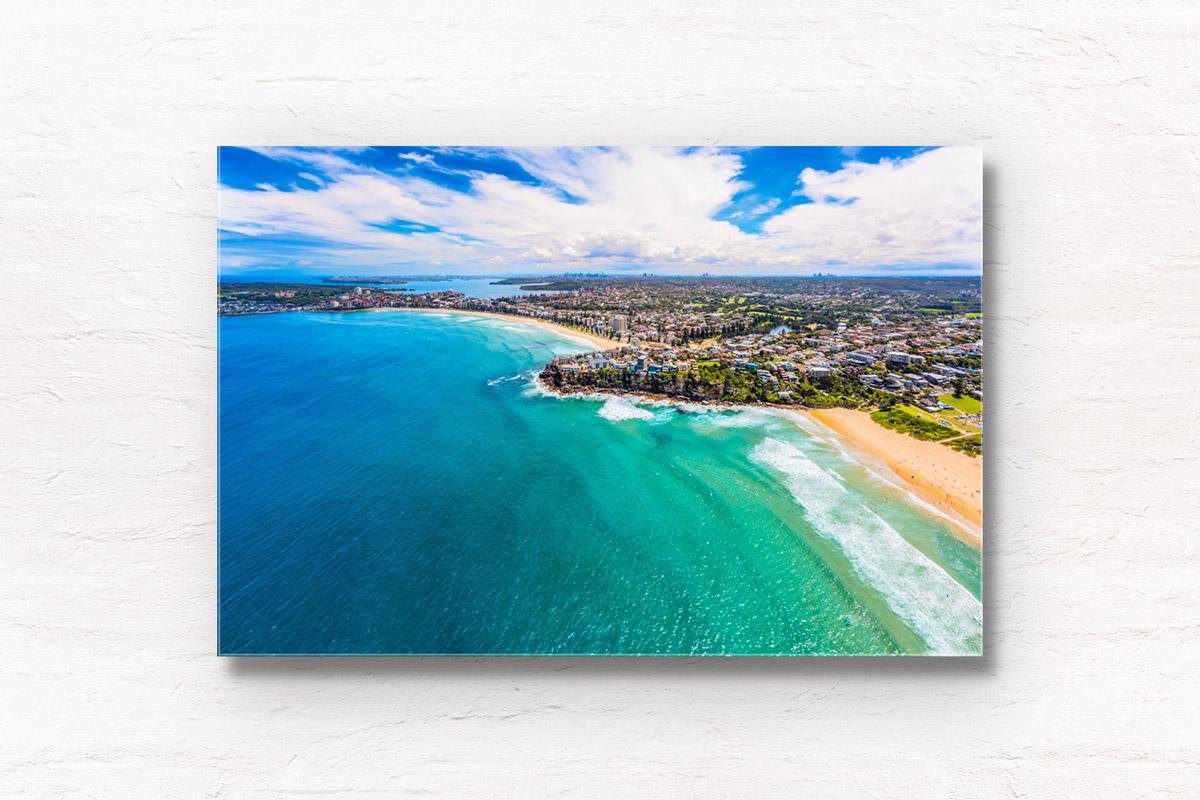 Aerial view above Manly and Freshwater Beach on a sunny day. Framed art photography wall art print.