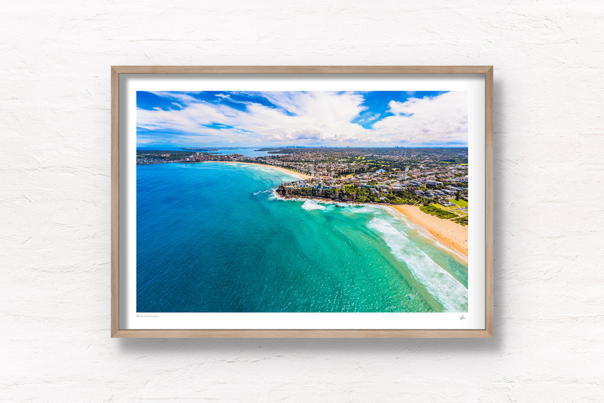 Aerial view above Manly and Freshwater Beach on a sunny day. Framed art photography wall art print.