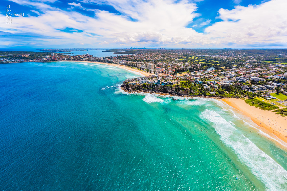 Aerial view above Manly and Freshwater Beach on a sunny day.